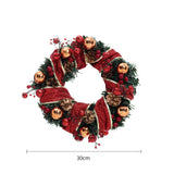 Red and gold Christmas wreath with ribbon loops, pine greenery, and ornaments
