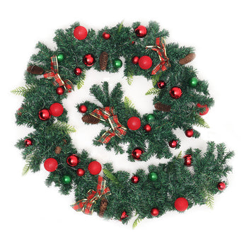 Holiday wreath with pine branches, red and green baubles, and plaid ribbon bows