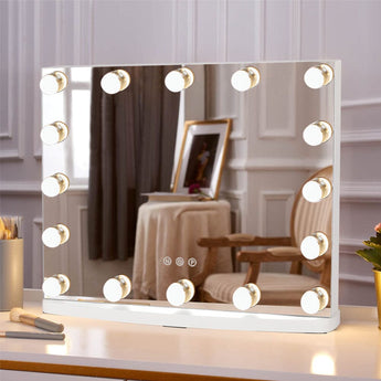 Rectangular vanity mirror with round bulbs and illuminated frame, angled view