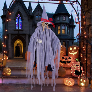 Purple-gray hanging witch decoration with skull face, pointed hat, and hanging lace veil