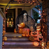 Hanging skull ghost figure in black sheer cloak, glowing blue eyes and bony hands
