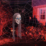 Hanging skull ornament with long gray strands and glowing blue eyes