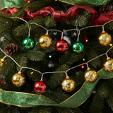 Christmas ball ornament string lights with gold, green, red and “Merry Christmas” bulbs