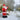 Inflatable Santa Claus yard decoration waving, red with white beard and black base