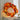 Autumn leaf wreath with orange, yellow, and red foliage and warm string lights