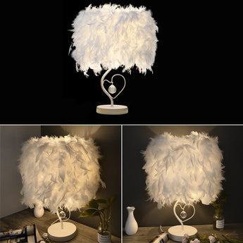 White feather heart table lamp with round base and crystal heart pendant