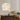 White feather table lamp on round base with heart-shaped stand, bedside style