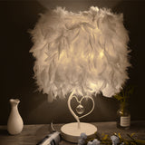 White feather table lamp with heart-shaped metal stand and crystal pendant