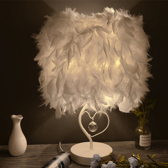 White feather table lamp with heart-shaped metal stand and crystal pendant