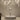 Heart-shaped metal stand with clear crystal pendant under white feather lampshade