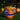 Halloween LED pumpkin with orange jack-o’-lantern carving and bright blue glowing eyes
