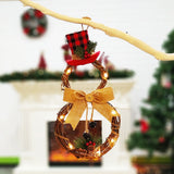 Lighted wreath snowman door decor with plaid top hat, burlap bow, warm white lights