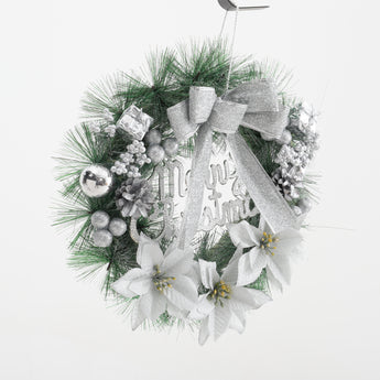 Front view Christmas wreath with silver bow, pine greenery, and white poinsettia accents