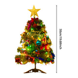 Artificial mini tabletop Christmas tree with gold star topper, multicolor LED lights, and red ornaments