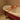 70cm bamboo bathtub bath tray laid across the tub rim with toiletries on top