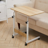 Movable laptop desk with maple wood top, lower shelf, white frame and locking casters