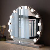 Hollywood vanity mirror with LED light bulbs around the round frameless glass