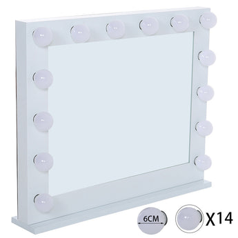 White makeup mirror on stand with round bulbs set into the frame