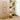 Beige wooden display ladder shelves with stepped open platforms and base frame