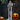 Skeleton ghost yard decoration with red eyes, black chain belt, draped gray shroud