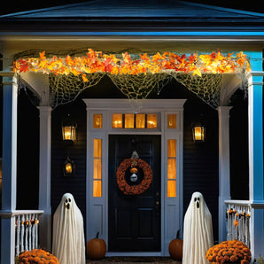 Hanging autumn maple leaf garland with warm LED lights, orange and red leaves