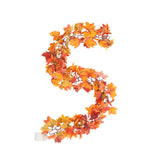 Artificial maple leaf garland loop with orange and red leaves on dark twig branches