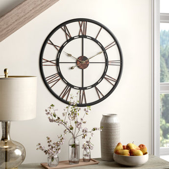 Large wall clock with Roman numeral-style dial, black frame and bronze-brown hands