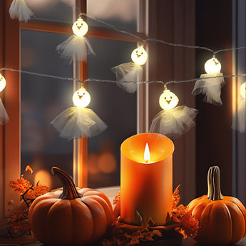 Glowing LED ghost light figures with white tulle skirts on hanging string