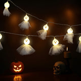 Lit ghost LED lights with round faces and layered white tulle skirts