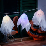 White glowing LED skull lights on string, sheer fabric ghost-style skulls