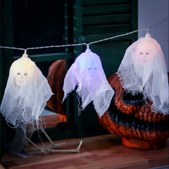 White glowing LED skull lights on string, sheer fabric ghost-style skulls