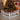 White wooden Christmas picket fence around a decorated tabletop tree