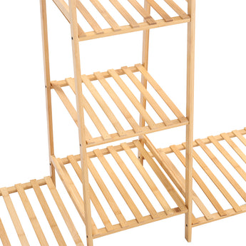 Close view of natural bamboo slatted shelves on a 5-tier clothes rack