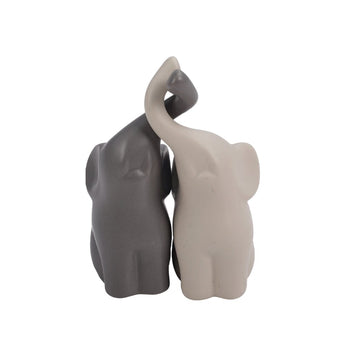 Ceramic couple elephant figurines, dark and light, close view
