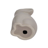 Single ceramic elephant figurine, light cream tone, underside with circular opening
