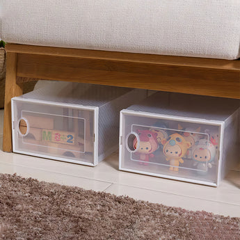 White plastic shoe storage bins with cartoon print and circular handle cutouts, 2-pack view