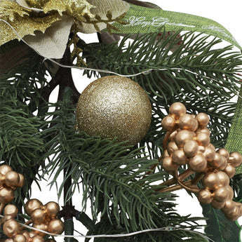 Pine swag garland detail with gold glitter baubles, pine needles, and berry clusters