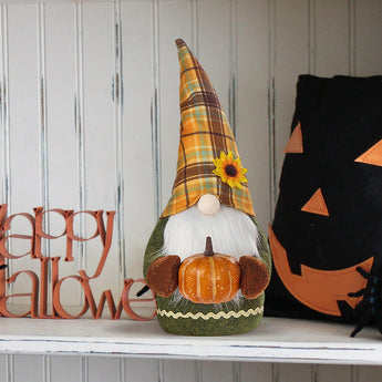 Handmade gnome decoration: plaid pointed hat with yellow flower and carved pumpkin