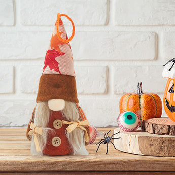 Thanksgiving gnome plush with long white beard, red outfit and tan button accents