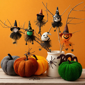 Halloween hanging characters on branches, including jack-o’-lantern, cat, witch and panda