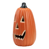 Orange LED-Halloweenlaterne von der Seite, geschnitztes Mundmuster, schwarze Oberseite