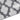 Corner/edge close-up showing geometric shag pattern and dark trim binding