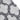 Texture close-up of the geometric shag pattern in white and dark grey