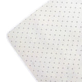 Rug backing view with light fabric and small repeating dot pattern