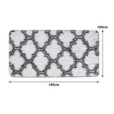 Rectangular plush area rug with gray geometric trellis on light background