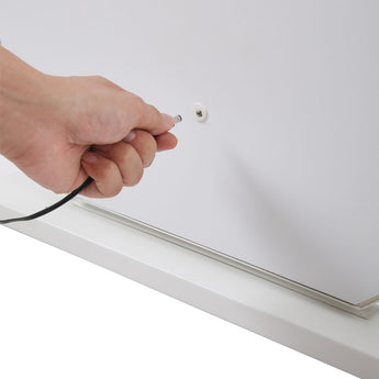 Plugging the power cable into the LED vanity mirror base