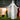 Inflatable white ghost decoration with red glowing eyes and outstretched arms