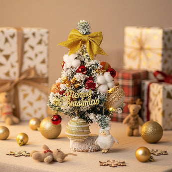 Tabletop Christmas tree with LED lights, gold bow, “Merry Christmas” sign, red and gold ornaments, dolls