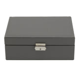 Dark grey faux leather jewellery organizer with lock and hinged lid