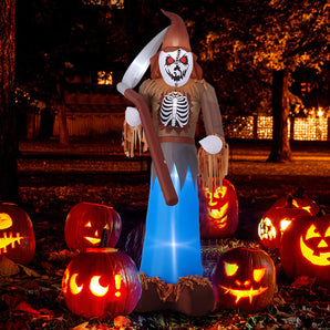 Lighted inflatable scarecrow grim reaper with scythe, upright figure with blue glow.